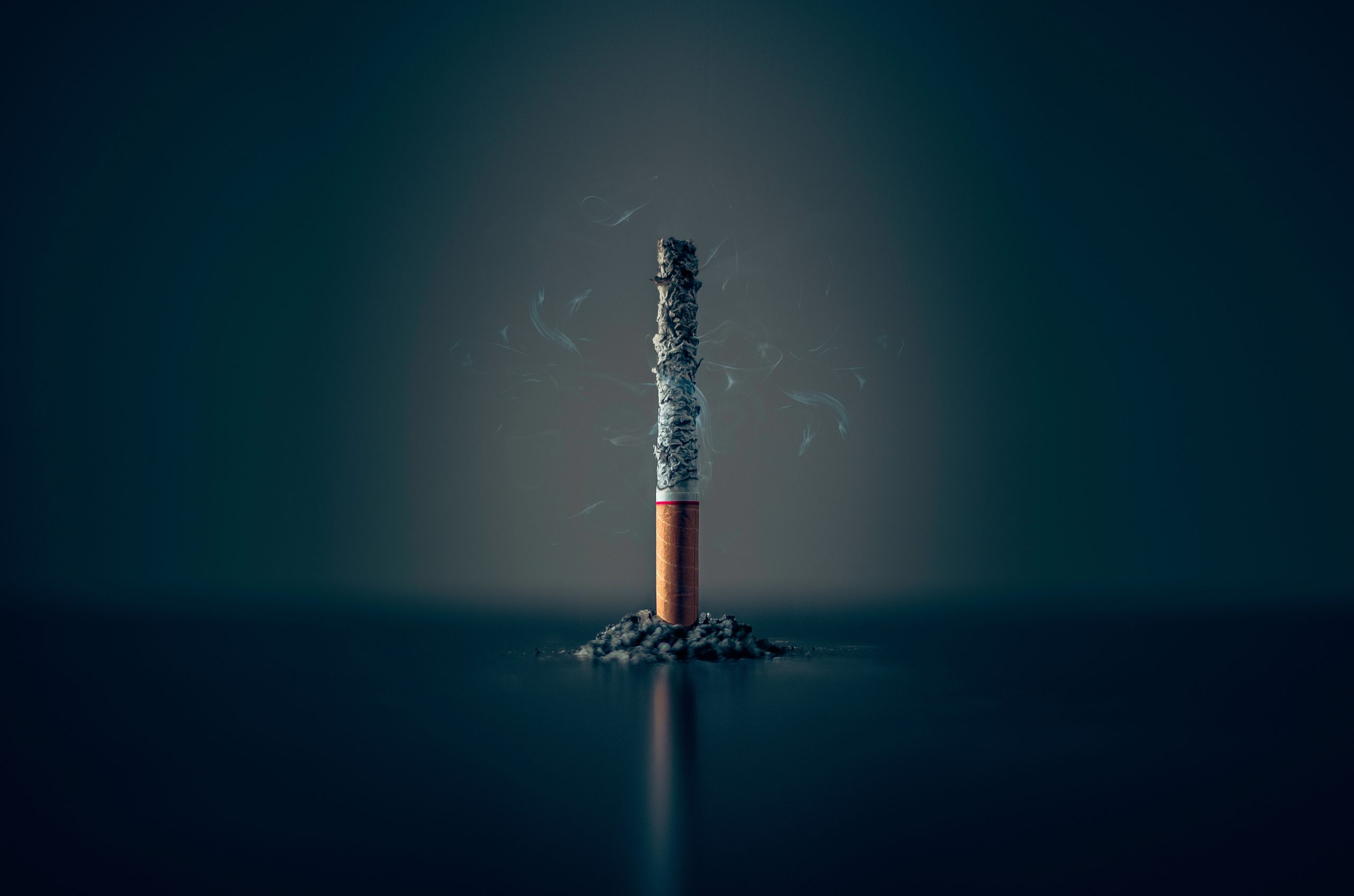 Quit Tobacco Program - burning cigarette