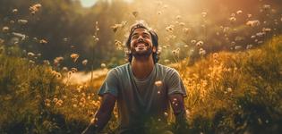 wellness for substance user - a guy smiling and happy in between garden of flowers2